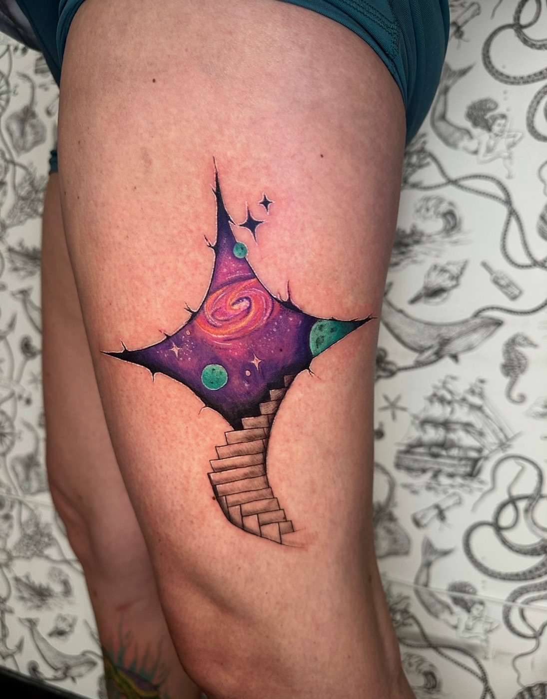Cosmic galaxy with planets and star color tattoo by Hanna McCoy