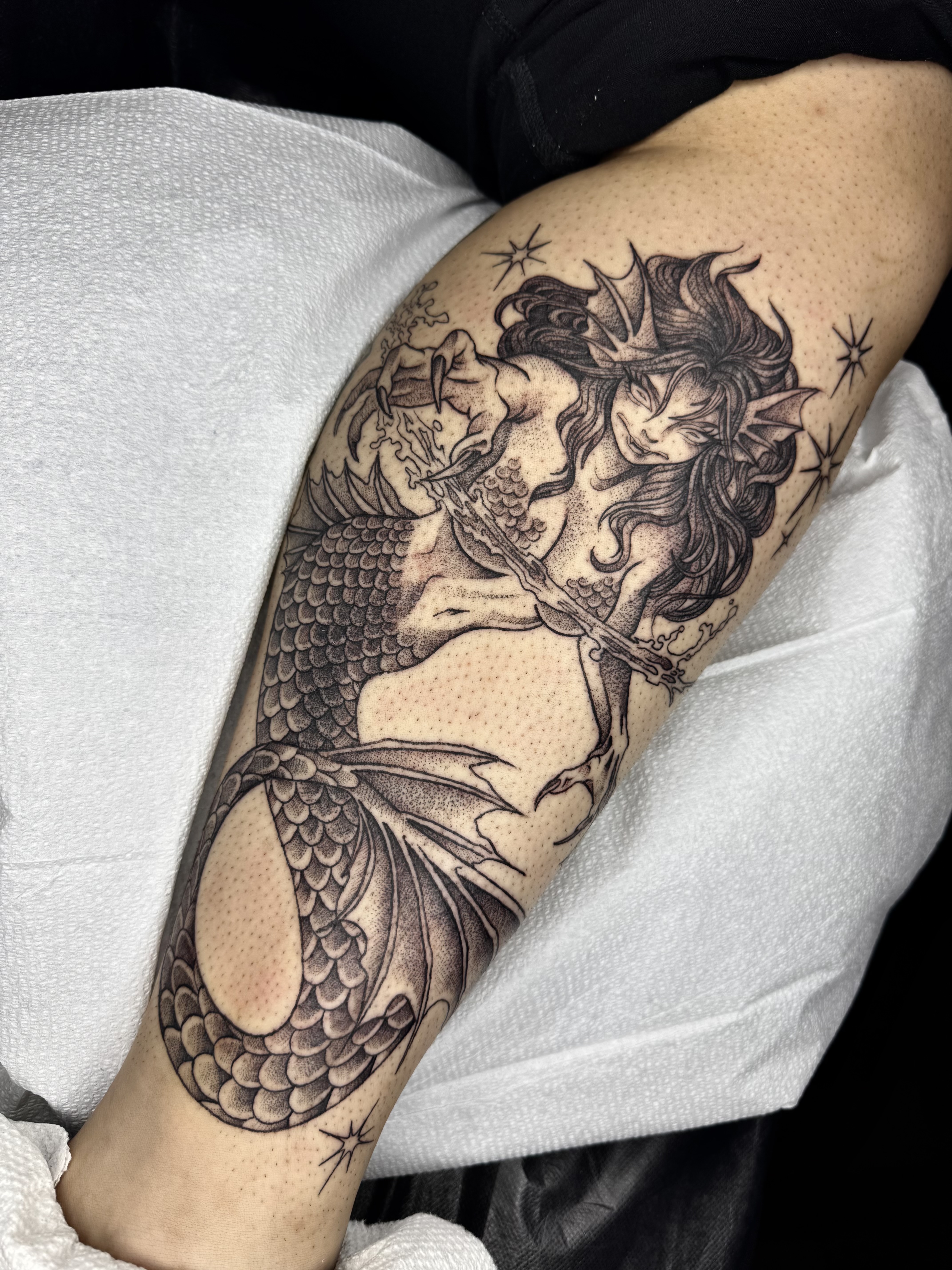 Dark mermaid with dagger fantasy tattoo by Julia Harley