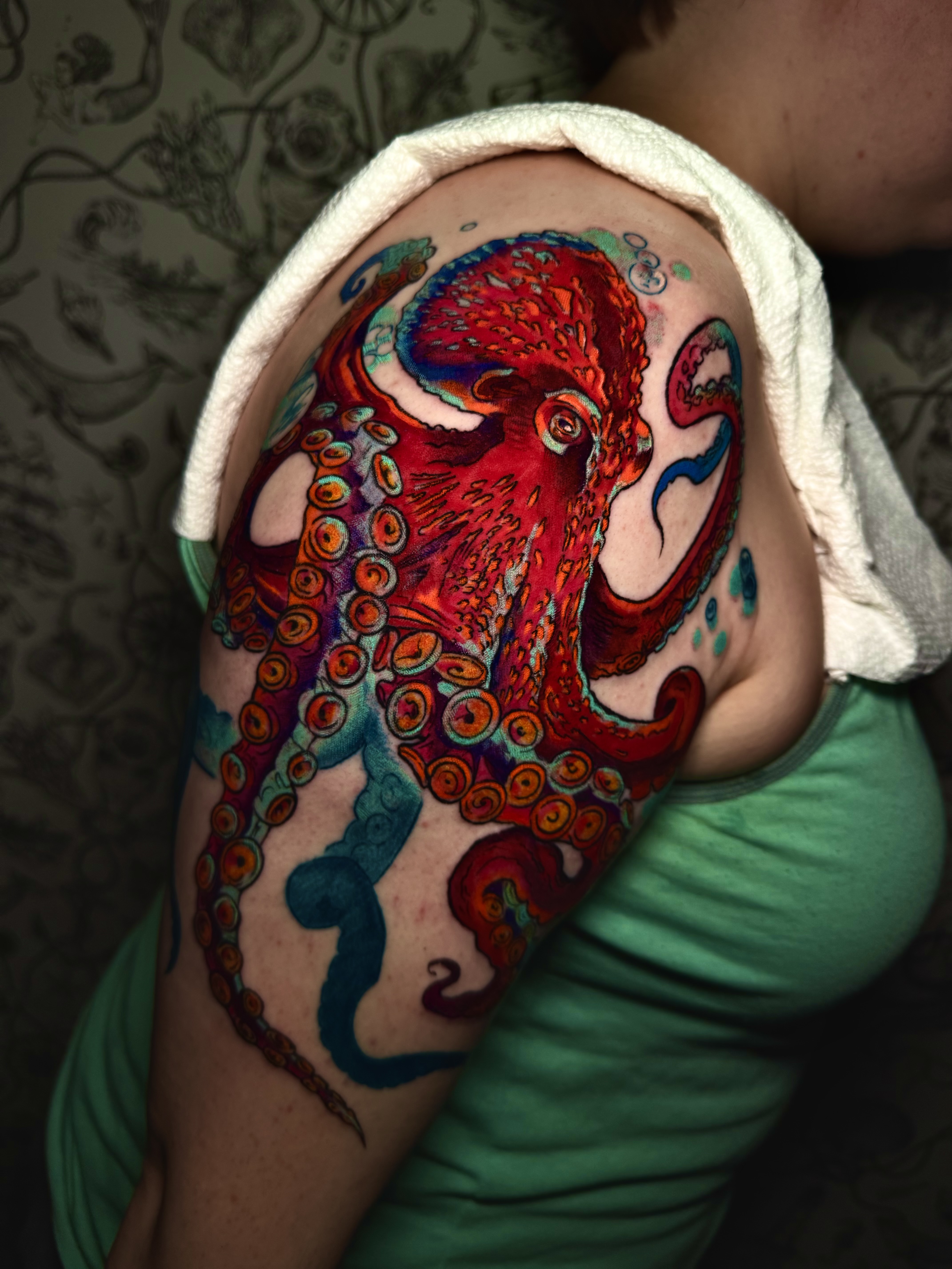 Red octopus neo-traditional tattoo by Whaling City Tattoo