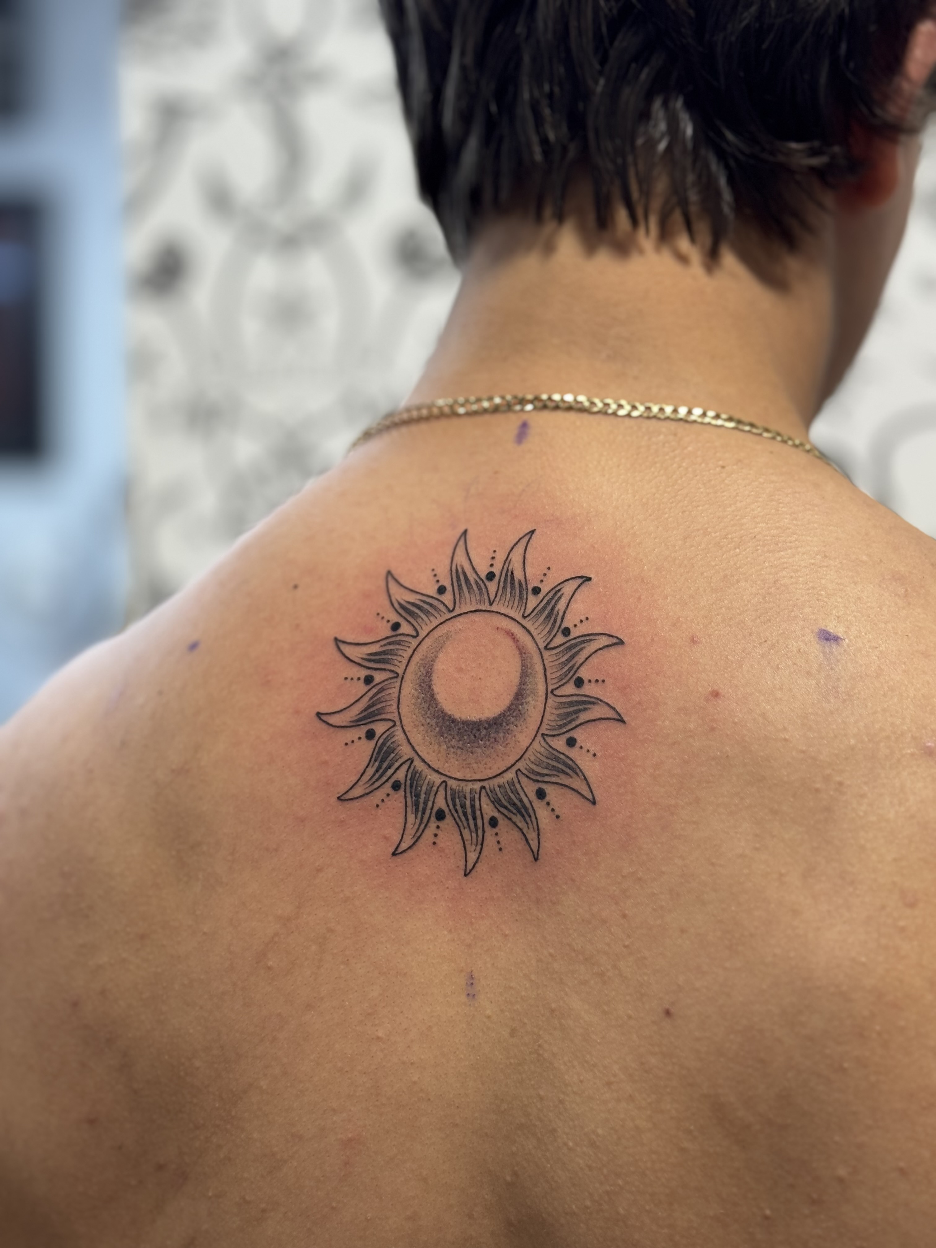 Sun and moon ornamental back tattoo by Julia Harley